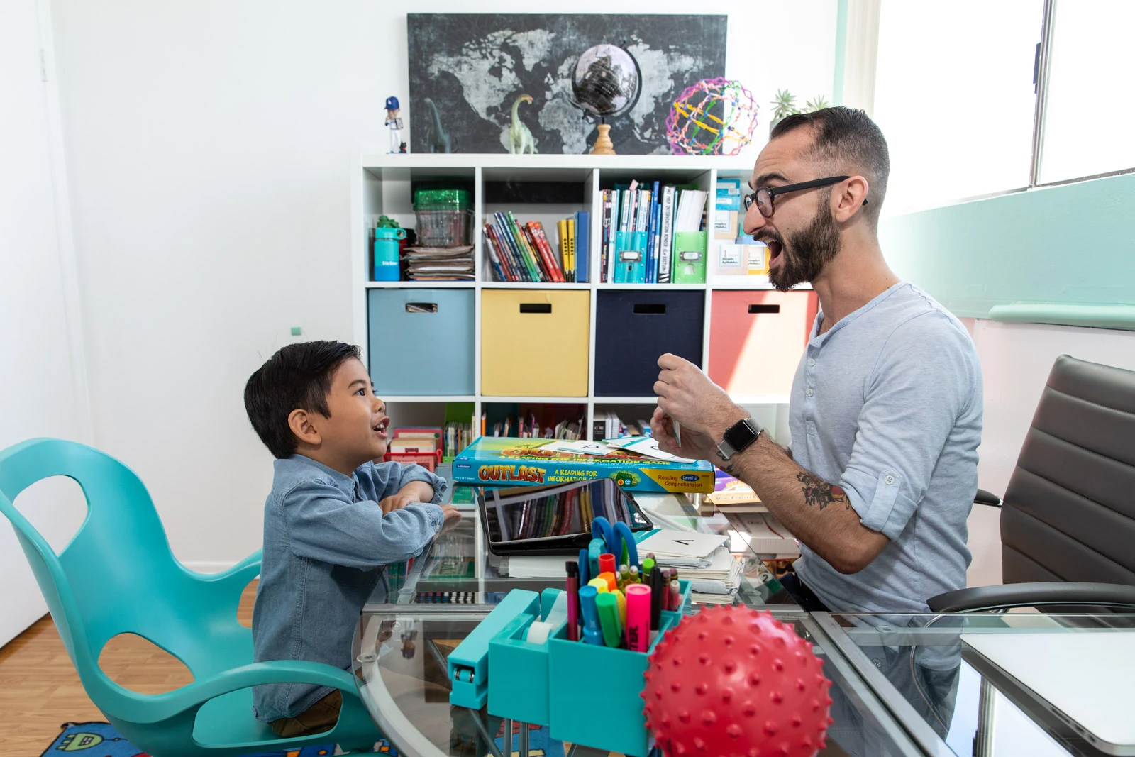Educator and student sharing an energetic, joyful learning session